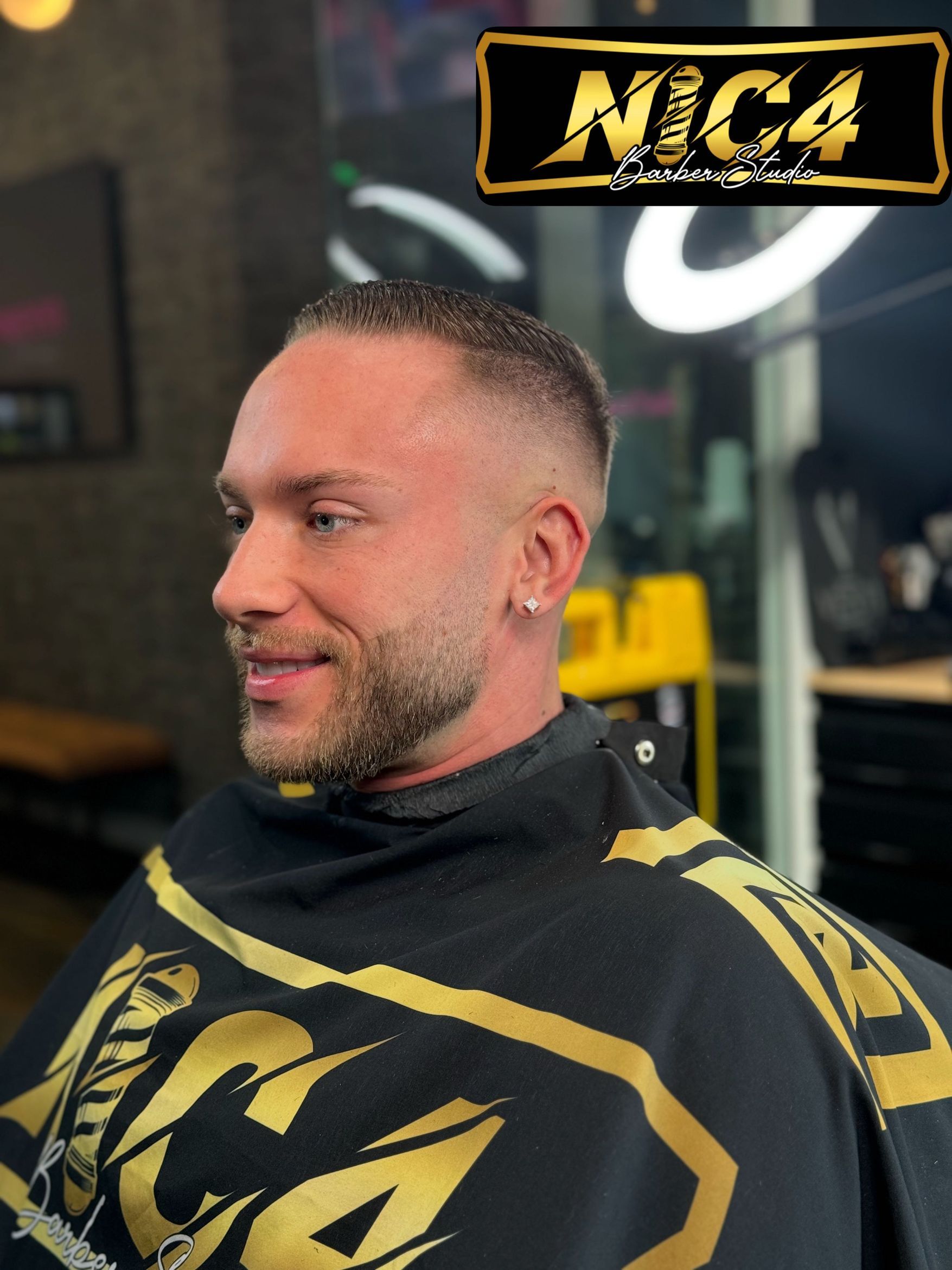 Clean fade at the nape.